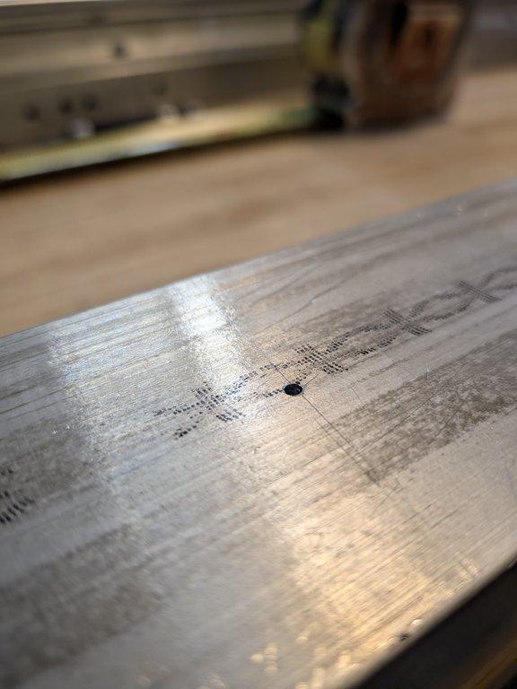 Boom arm main pivot support hole.