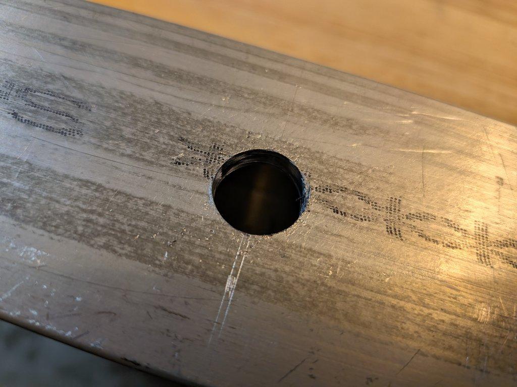 Boom arm main pivot support hole.