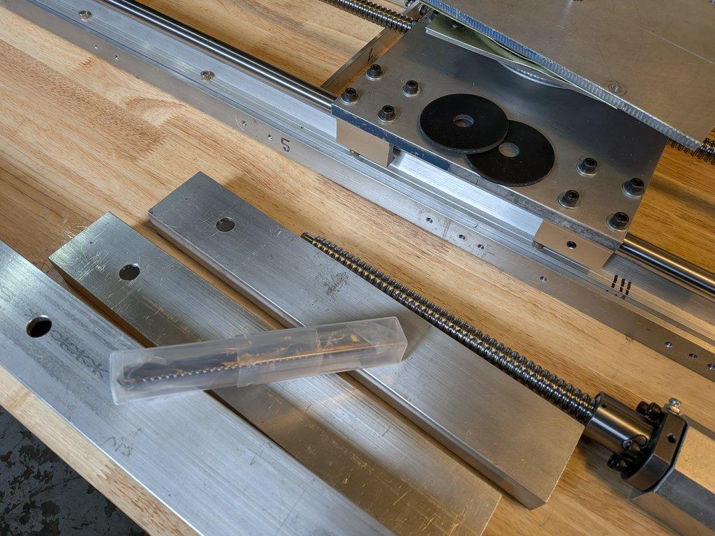 Boom arm main pivot support hole.