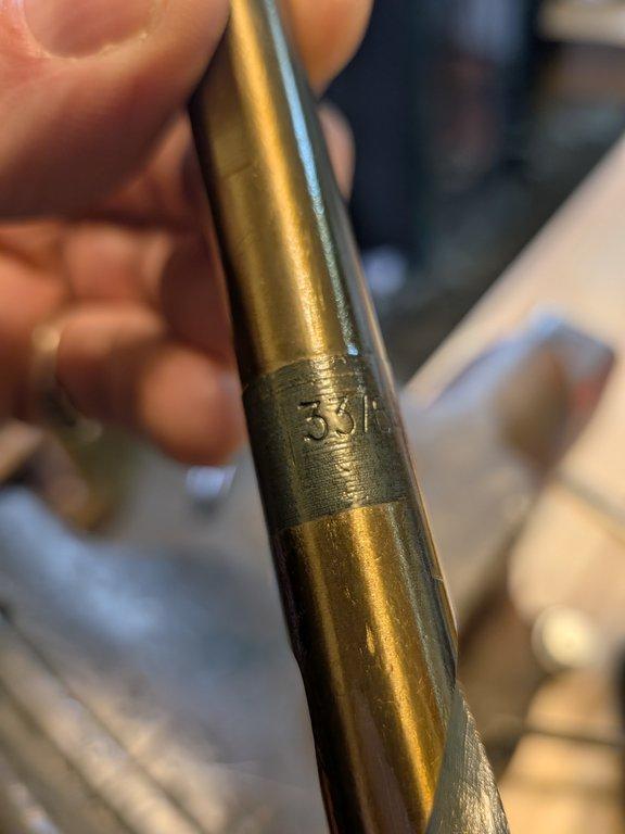 Boom arm main pivot support hole.