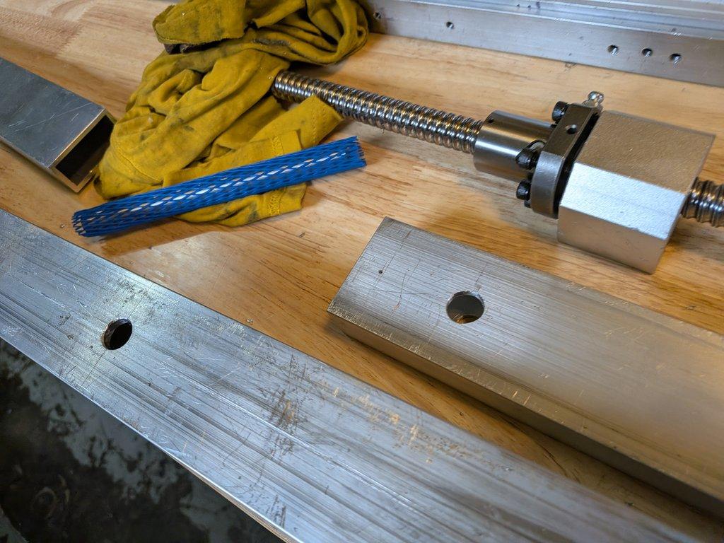 Boom arm main pivot support hole.