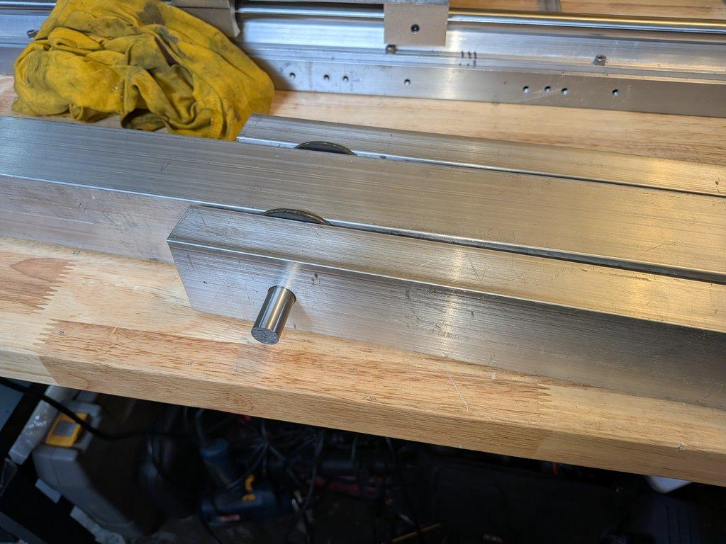 Boom arm main pivot support hole.